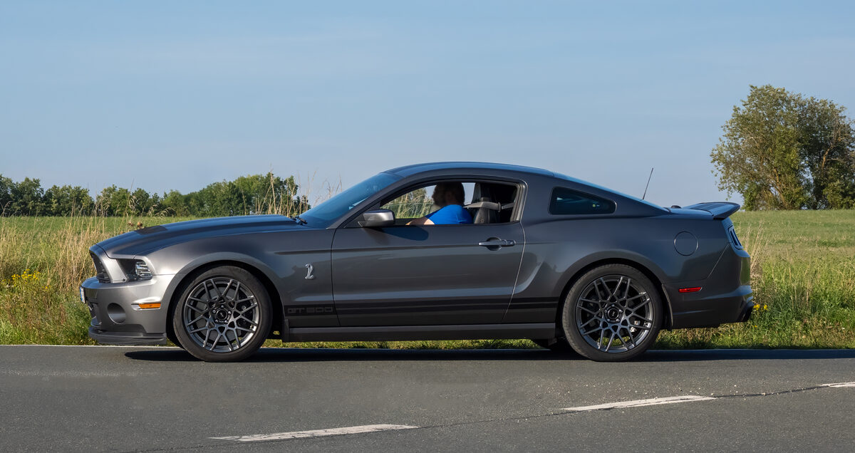 Grey Shelby Mustang GT500 parked on a country road